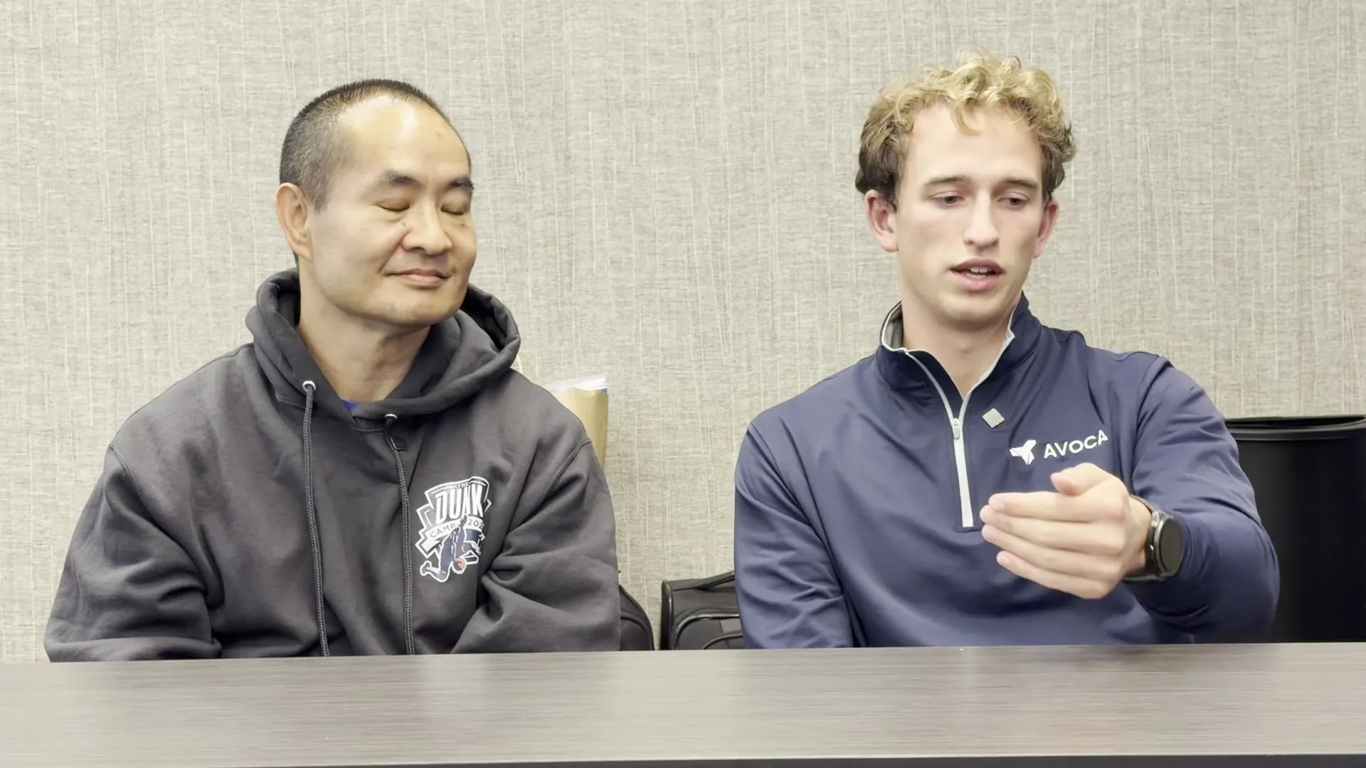Roanin and Dennis Yu talking at a table in Broomfield