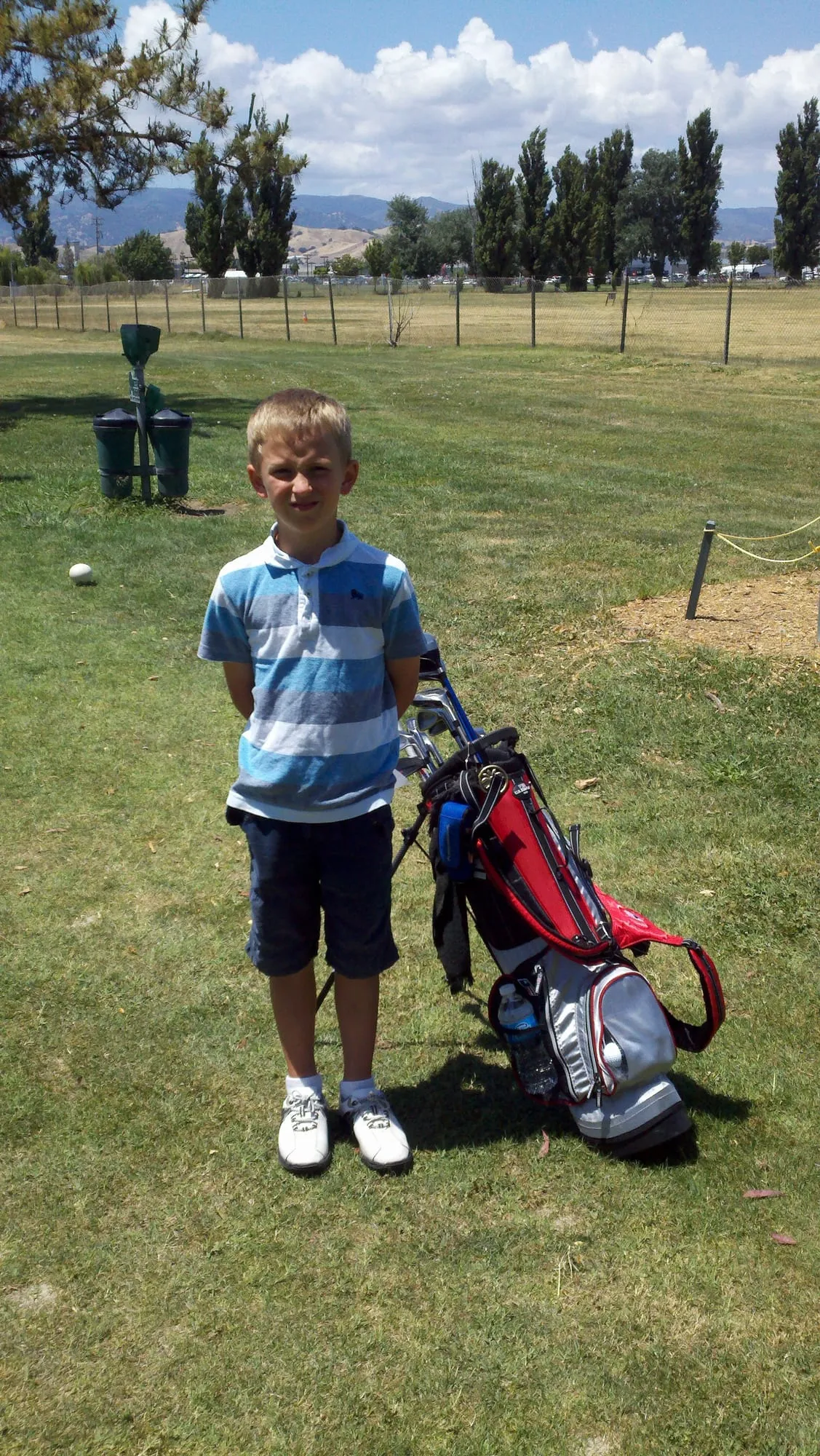Me as a kid with a golf bag