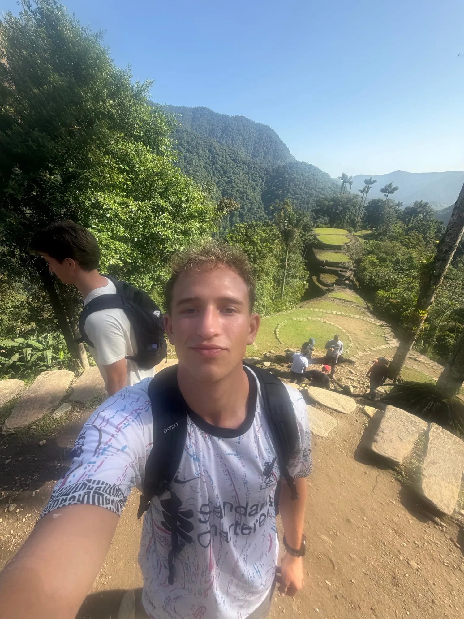 Roanin taking a selfie above the stone terraces of Teyuna, the Lost City, in the Colombian jungle