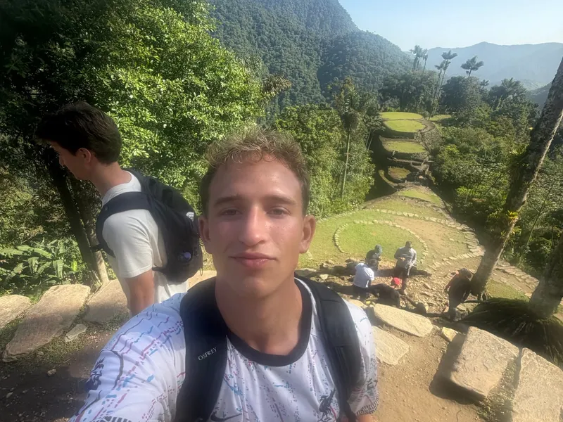 Roanin taking a selfie above the stone terraces of Teyuna, the Lost City, in the Colombian jungle