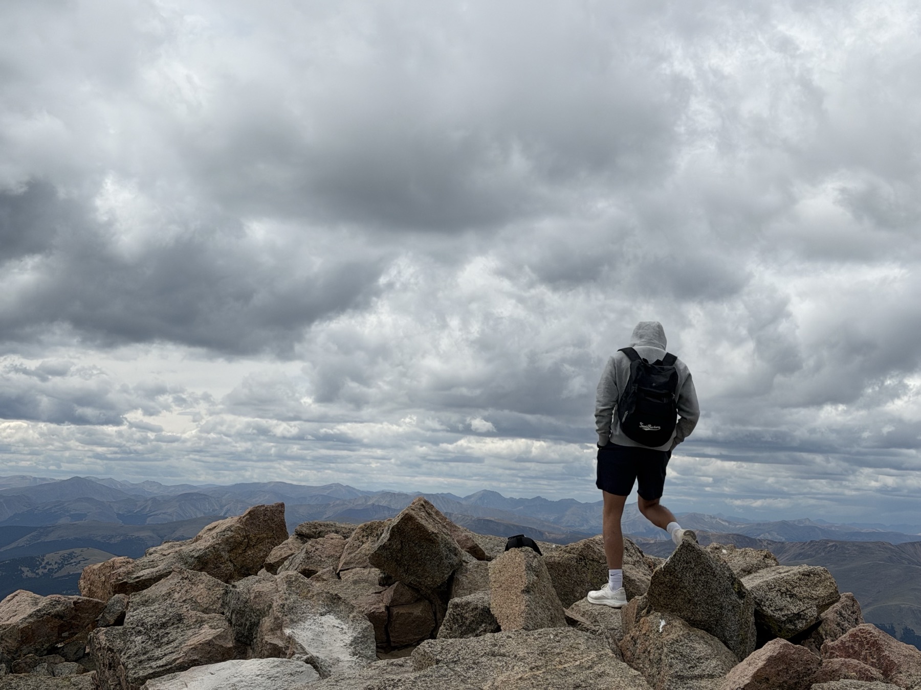 Hiker on the summit of Mt Bierstadt, 29 August 2026, looking across the Front Range